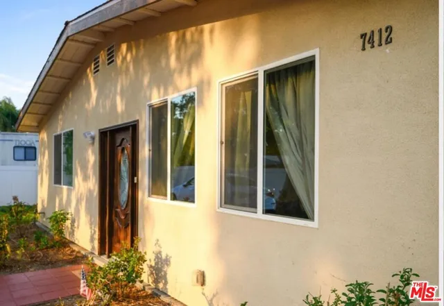 a view of yard with swimming pool and green space