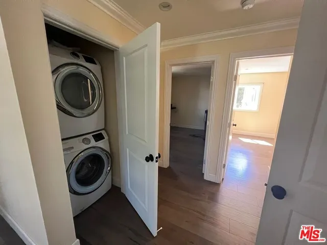 a bathroom with a granite countertop sink a mirror and shower