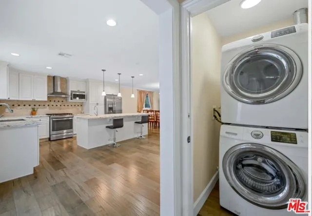 a view of a kitchen with washer and dryer