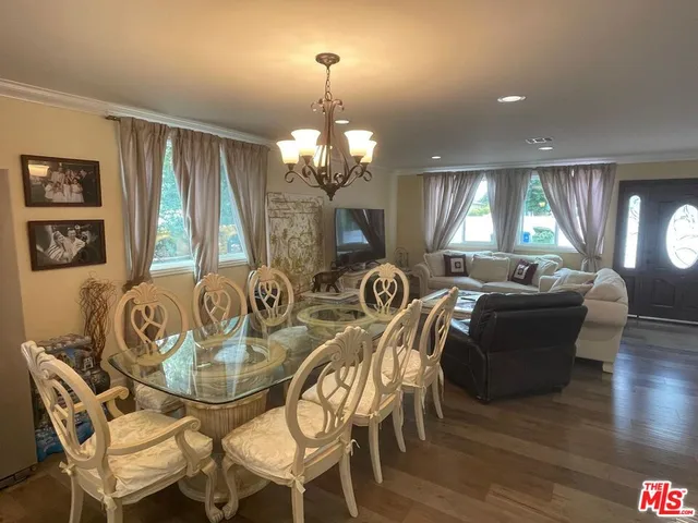 a view of a dining room with furniture and window