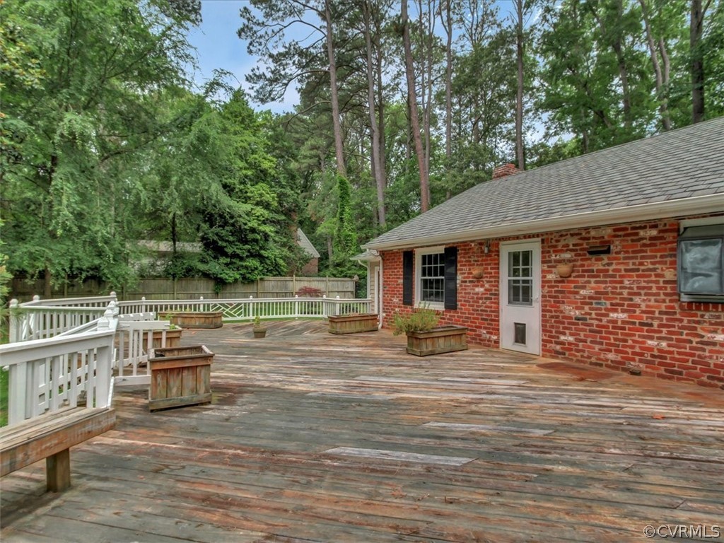 10231 Cherokee Road Richmond, VA 23235 - Photo 32 of 39 a backyard of a house with wooden floor and outdoor seating