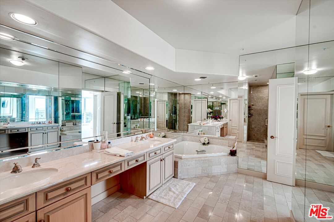 10580 Wilshire Boulevard, Unit 8SW Los Angeles, CA 90024 - Photo 14 of 38 a large white kitchen with a large window