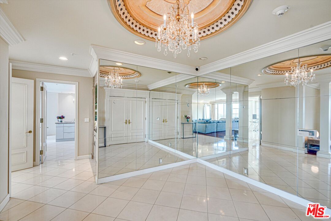 10580 Wilshire Boulevard, Unit 8SW Los Angeles, CA 90024 - Photo 24 of 38 a spacious bathroom with a glass shower door and mirror