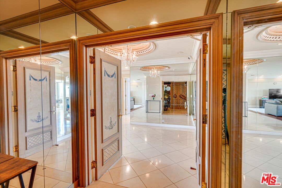 10580 Wilshire Boulevard, Unit 8SW Los Angeles, CA 90024 - Photo 3 of 38 a view of a bathroom with a glass door and a glass door
