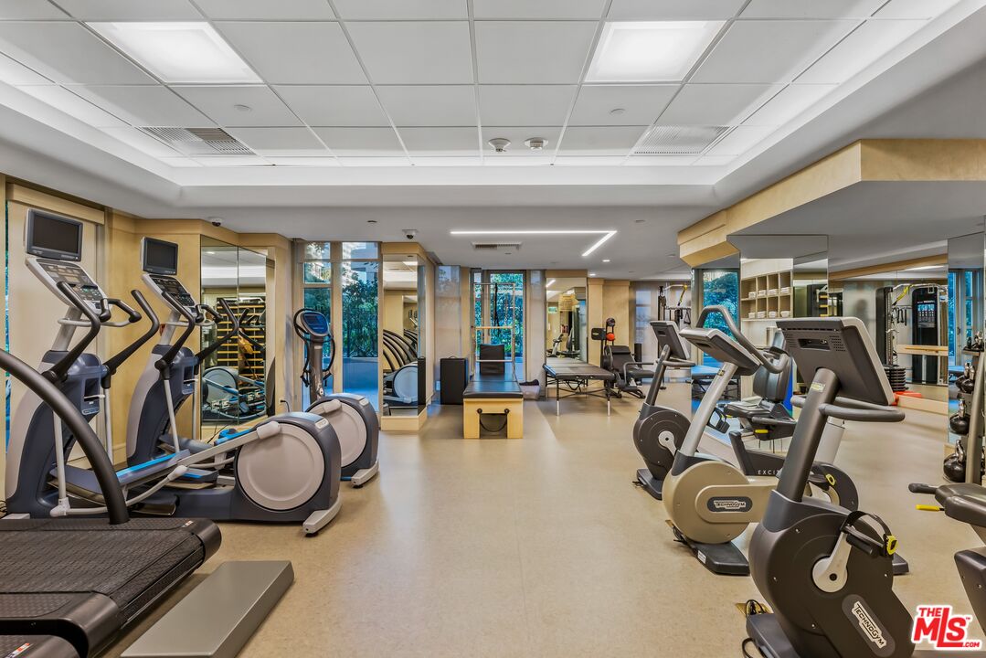 10580 Wilshire Boulevard, Unit 8SW Los Angeles, CA 90024 - Photo 31 of 38 a view of a room with gym equipment