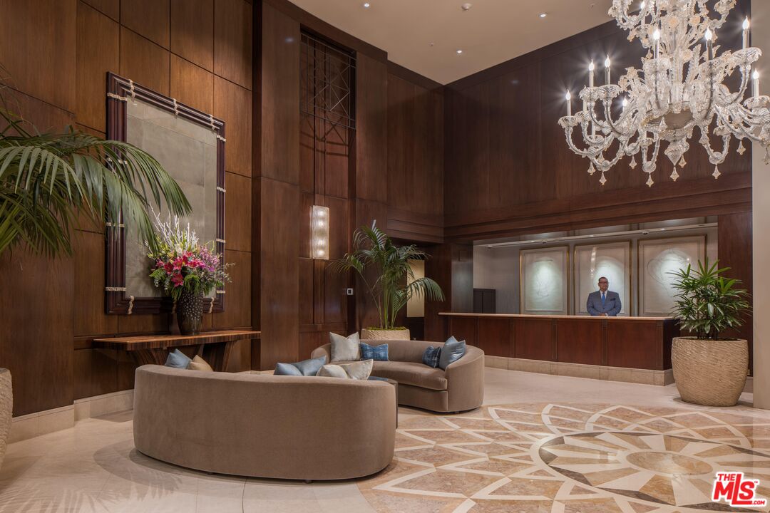 10580 Wilshire Boulevard, Unit 8SW Los Angeles, CA 90024 - Photo 34 of 38 a living room with furniture and a potted plant