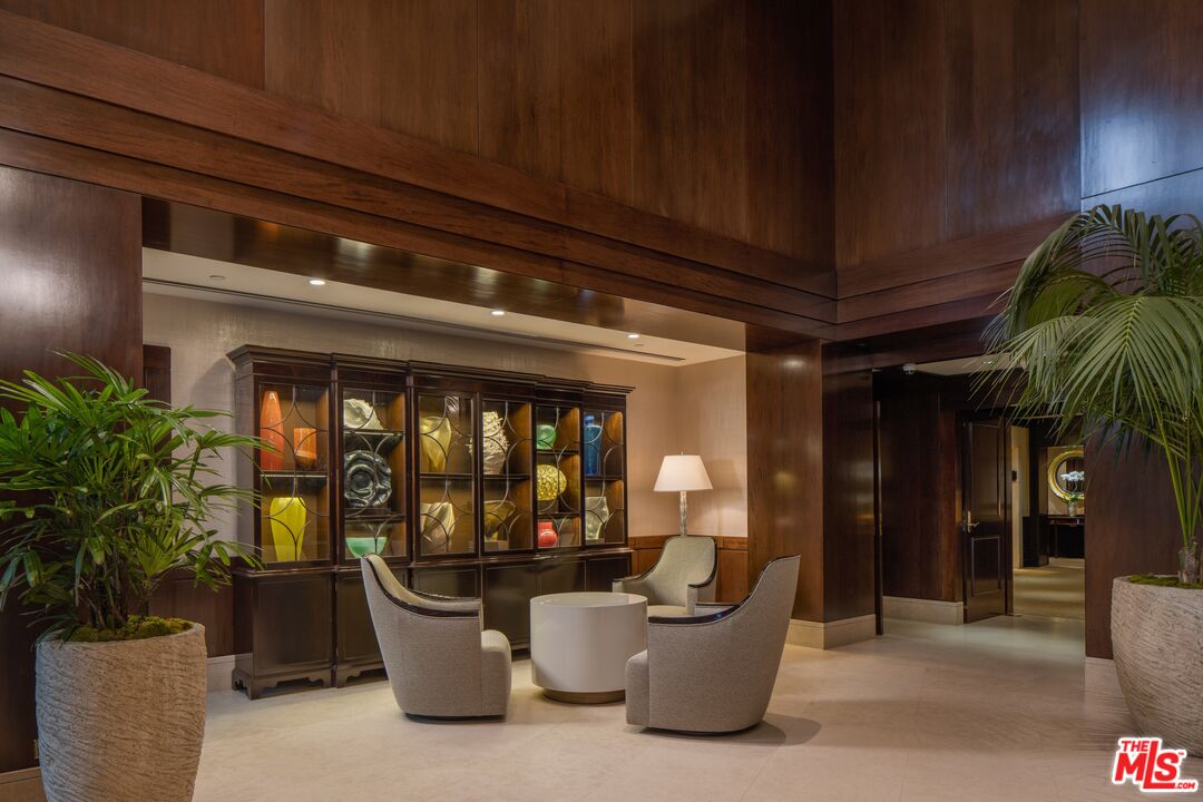 10580 Wilshire Boulevard, Unit 8SW Los Angeles, CA 90024 - Photo 35 of 38 a living room with furniture and a potted plant