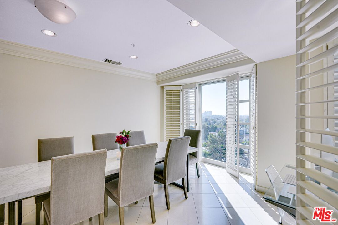 10580 Wilshire Boulevard, Unit 8SW Los Angeles, CA 90024 - Photo 8 of 38 a view of a dining room with furniture window and outside view