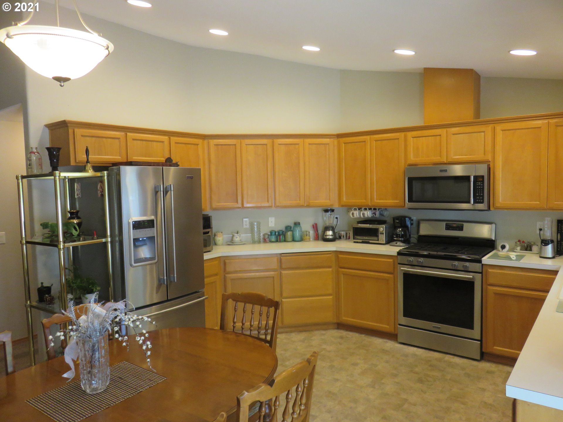 4563 Swegle Road Northeast Salem, OR 97301 - Photo 3 of 19 a kitchen with stainless steel appliances granite countertop a refrigerator and a stove top oven