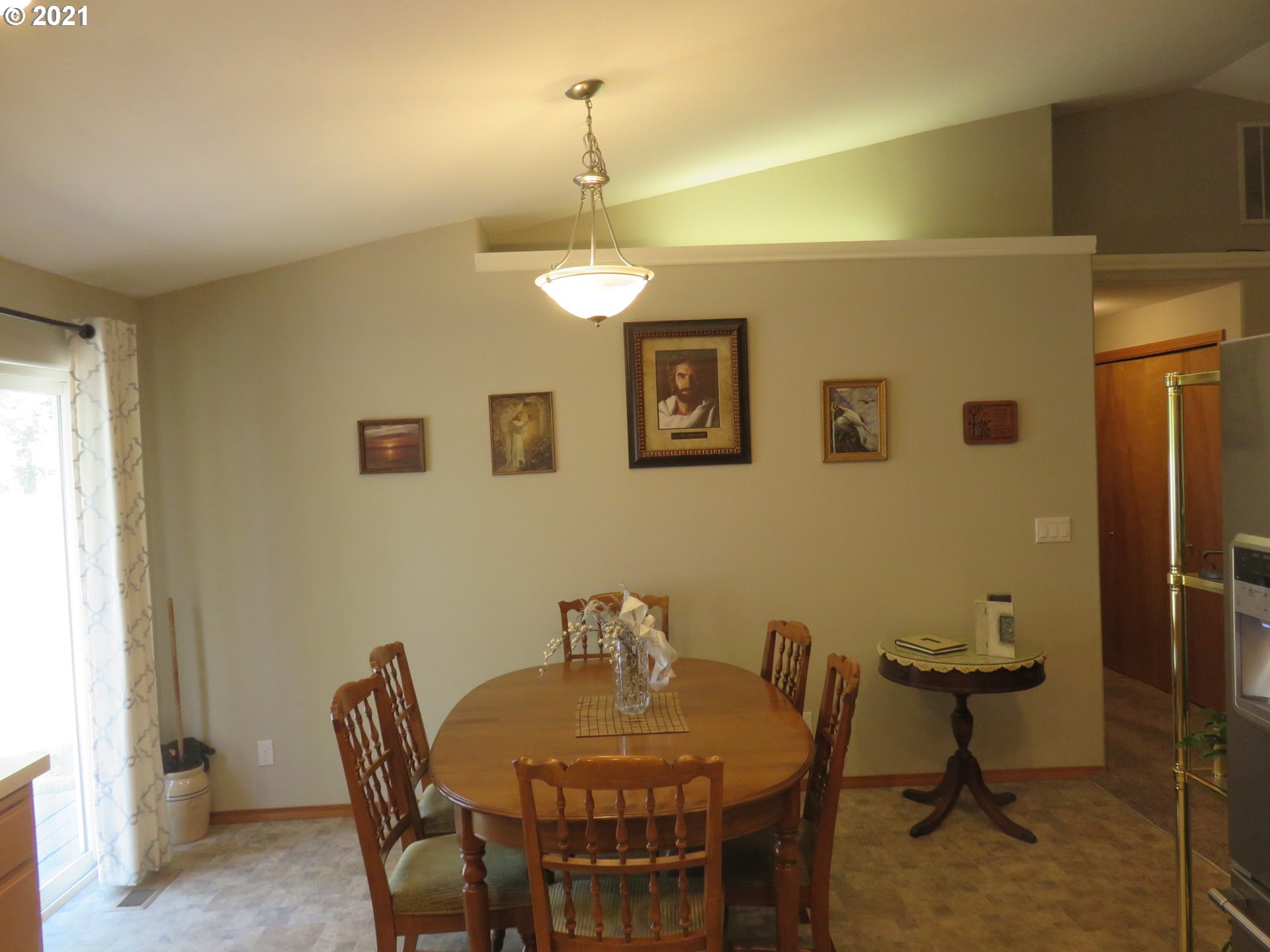 4563 Swegle Road Northeast Salem, OR 97301 - Photo 8 of 19 a view of a dining room with furniture and chandelier