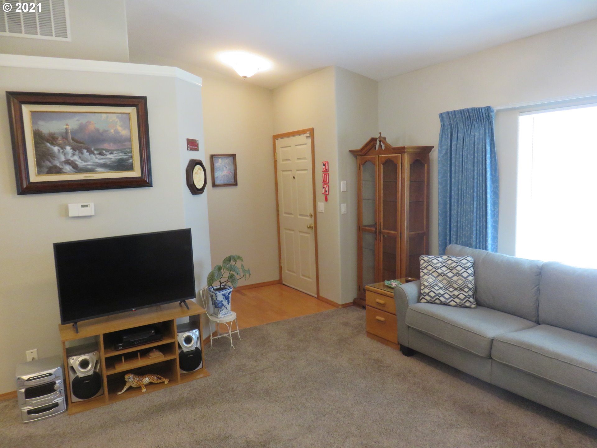 4563 Swegle Road Northeast Salem, OR 97301 - Photo 10 of 19 a living room with furniture and a flat screen tv
