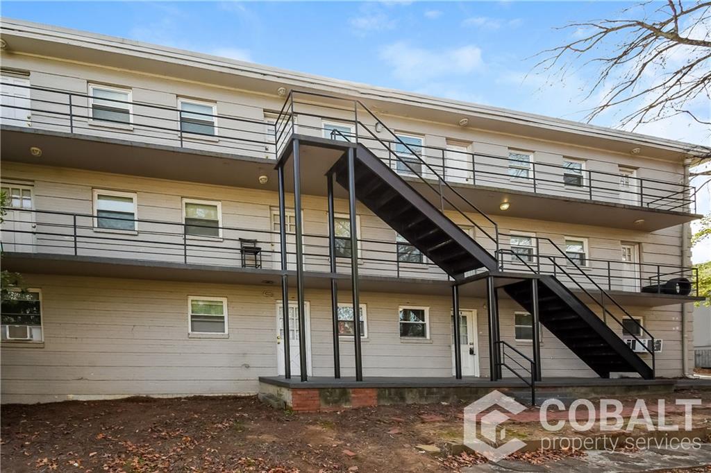 1990 Rockledge Road Northeast, Unit 3 Atlanta, GA 30324 - Photo 8 of 8 a view of a house with a garage