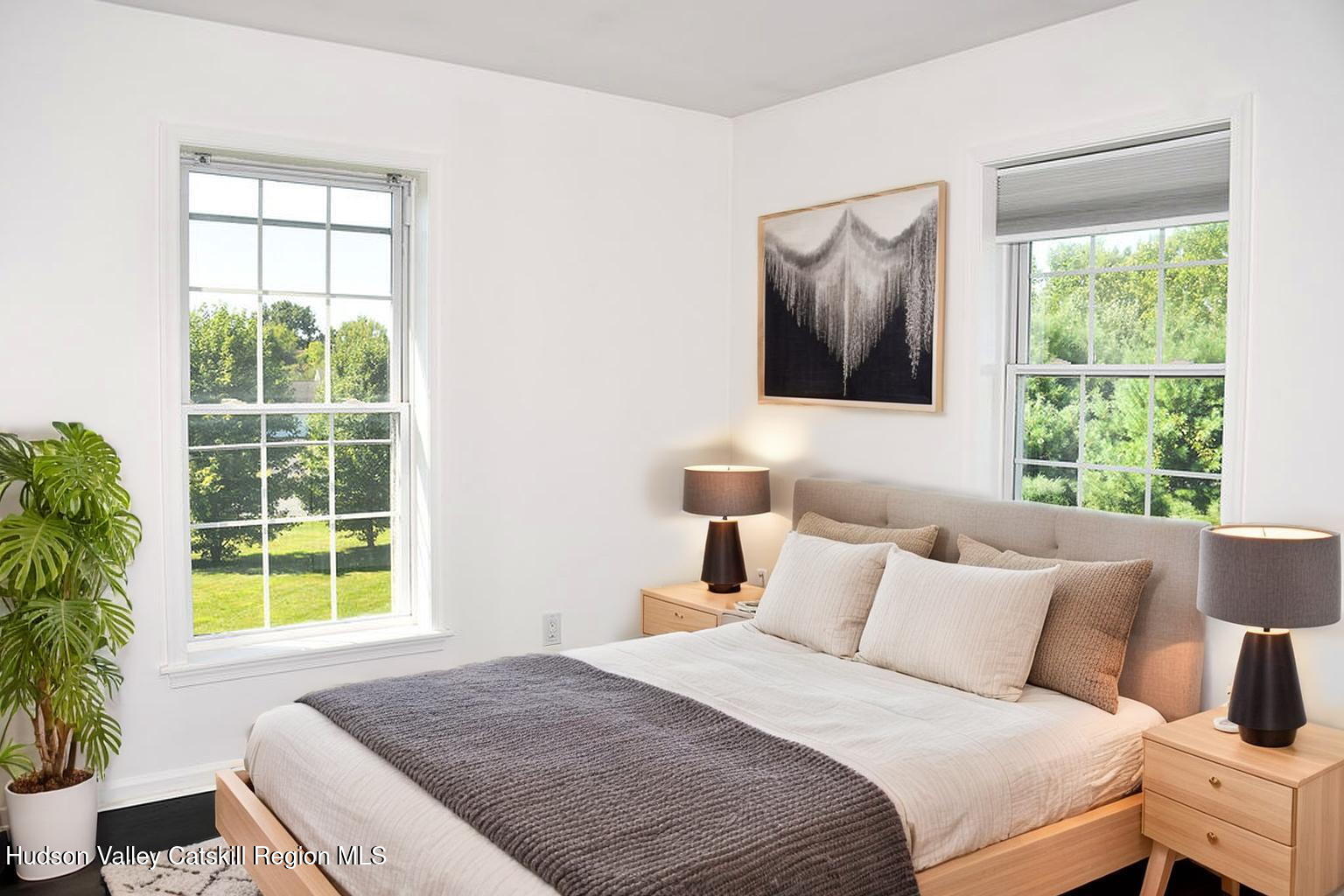 49 MacIntosh Drive Hudson, NY 12534 - Photo 24 of 39 a bedroom with a large bed and a window