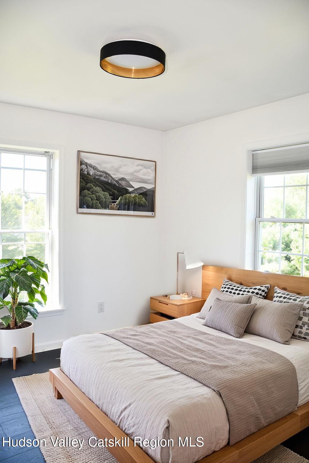 49 MacIntosh Drive Hudson, NY 12534 - Photo 27 of 39 a bedroom with a bed and a painting