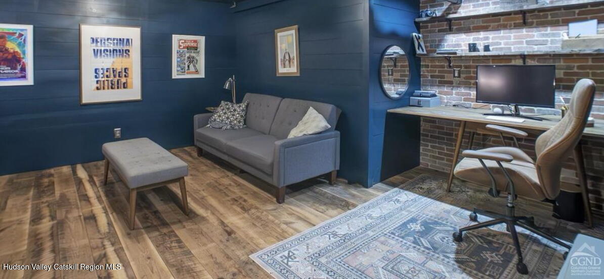 49 MacIntosh Drive Hudson, NY 12534 - Photo 33 of 39 a living room with furniture and a fireplace