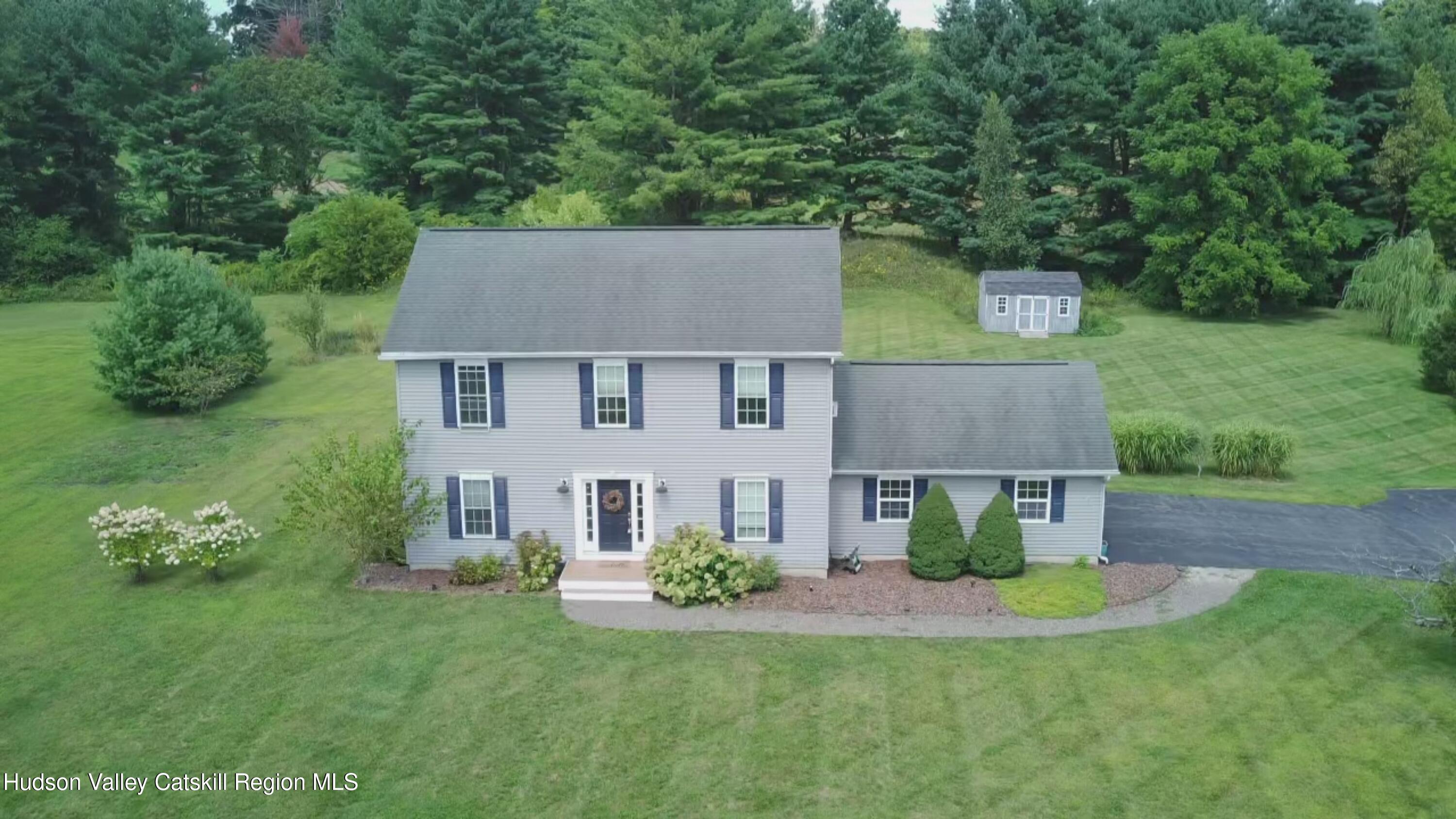 49 MacIntosh Drive Hudson, NY 12534 - Photo 36 of 39 a aerial view of a house with swimming pool next to a big yard