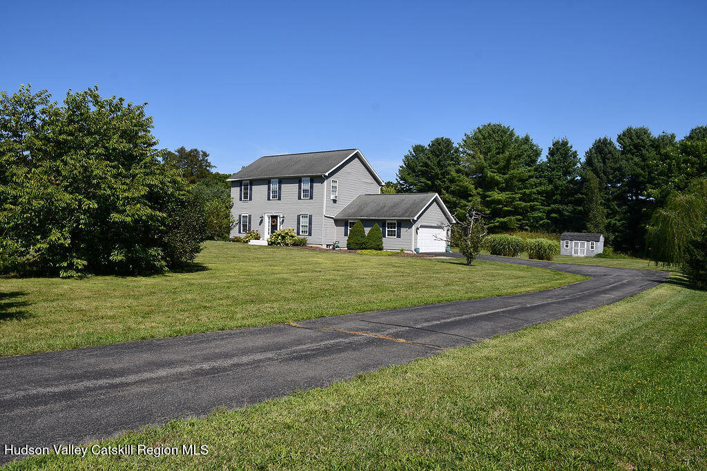 49 MacIntosh Drive Hudson, NY 12534 - Photo 4 of 39 a front view of a house with a yard