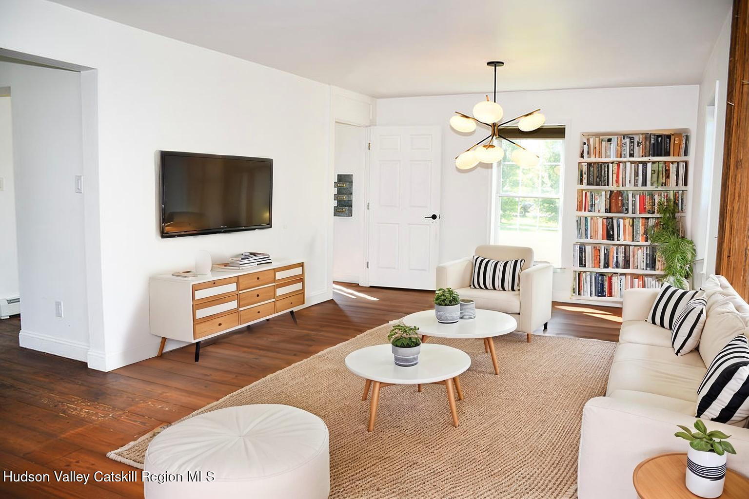 49 MacIntosh Drive Hudson, NY 12534 - Photo 8 of 39 a living room with furniture and a flat screen tv