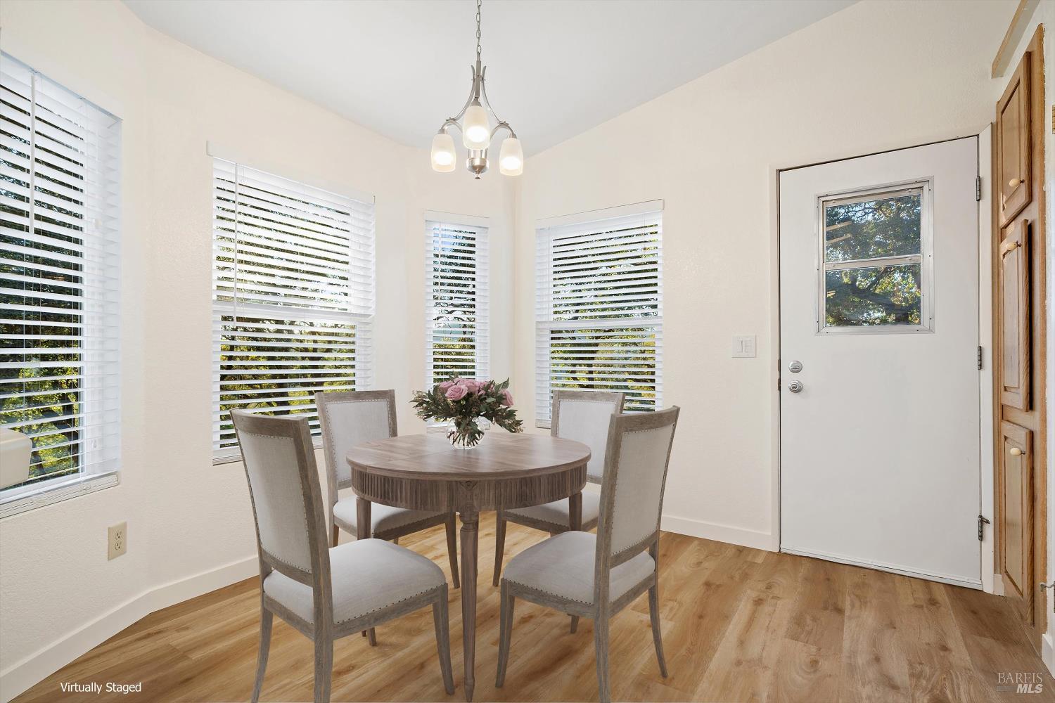 27770 Asti Road Cloverdale, CA 95425 - Photo 16 of 35 a view of a dining room with furniture wooden floor and a chandelier