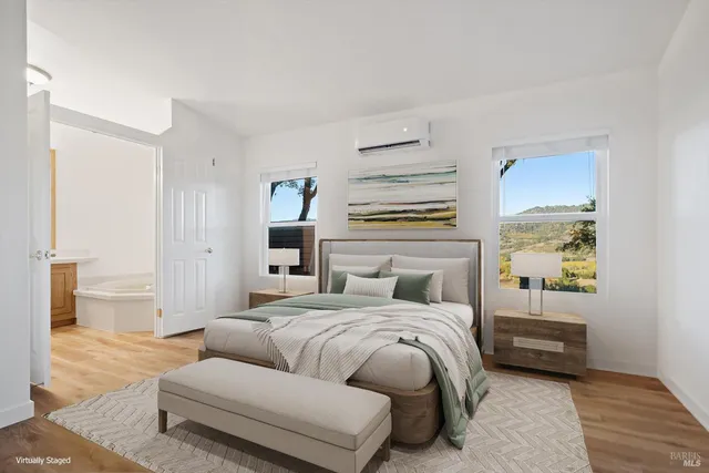 a bedroom with a bed and a couch