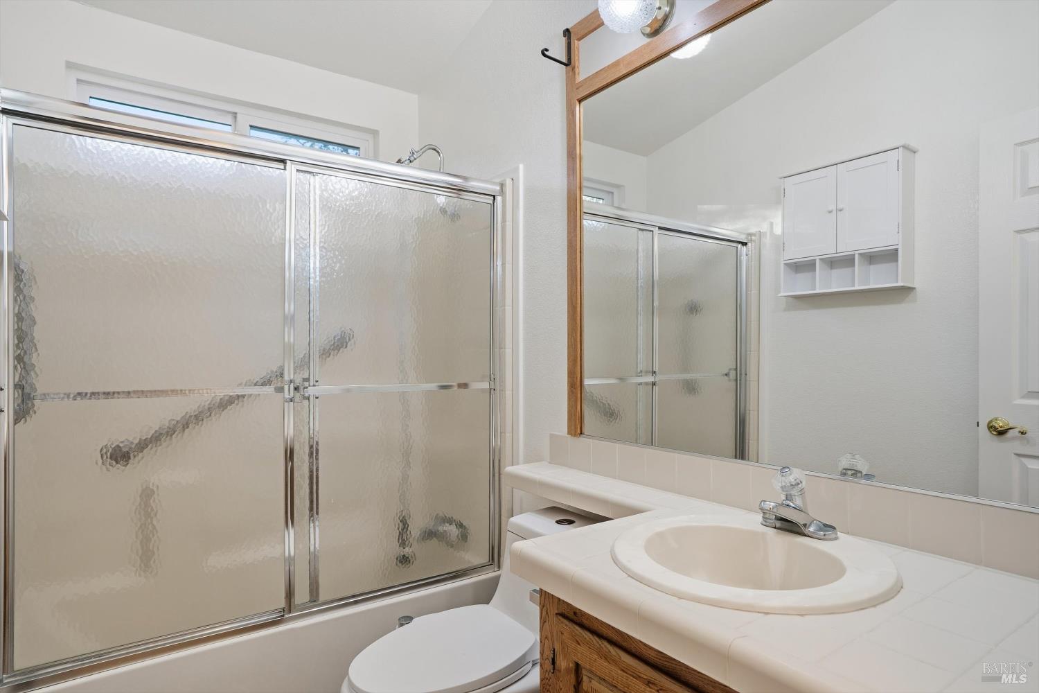 27770 Asti Road Cloverdale, CA 95425 - Photo 22 of 35 a bathroom with a sink toilet and shower