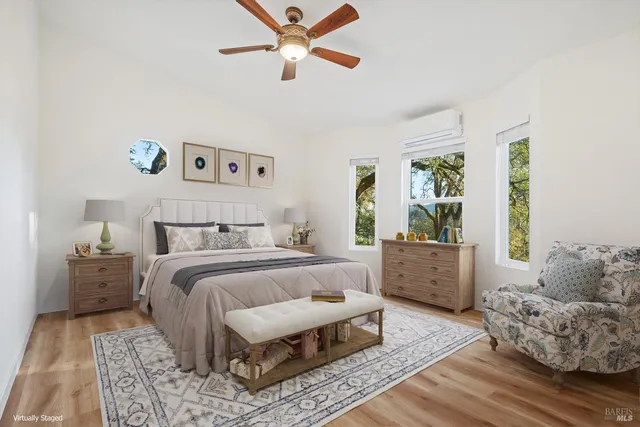 a bedroom with a large bed and a couch