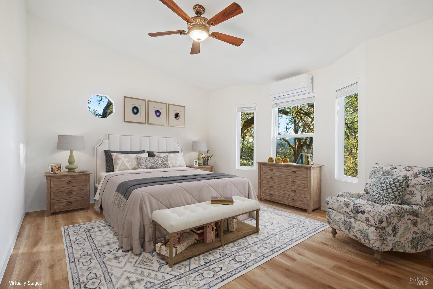 27770 Asti Road Cloverdale, CA 95425 - Photo 23 of 35 a bedroom with a large bed and a couch