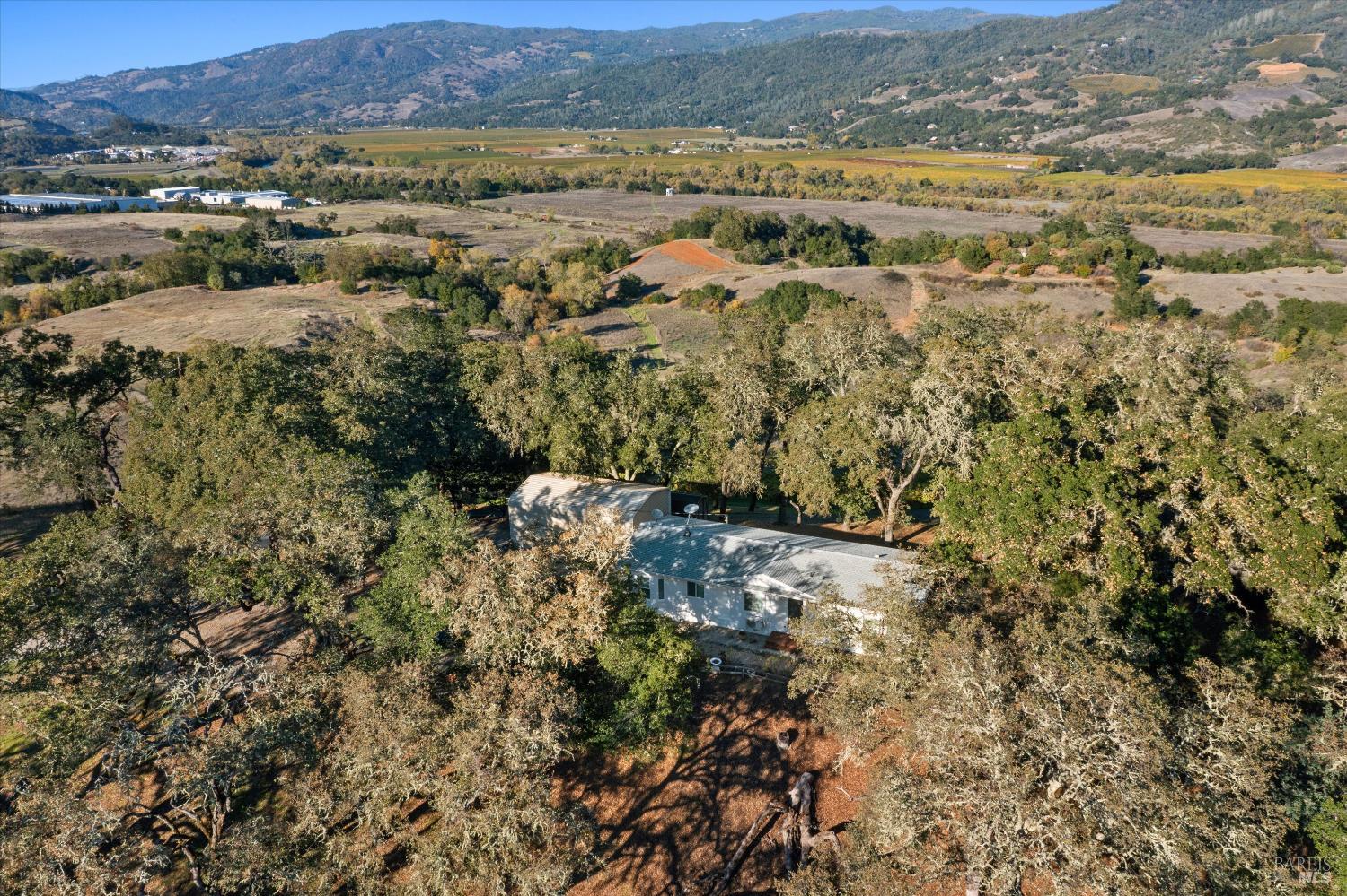 27770 Asti Road Cloverdale, CA 95425 - Photo 8 of 35 an aerial view of residential houses with outdoor space and trees