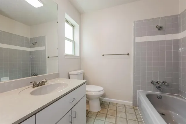a bathroom with a sink toilet and bathtub