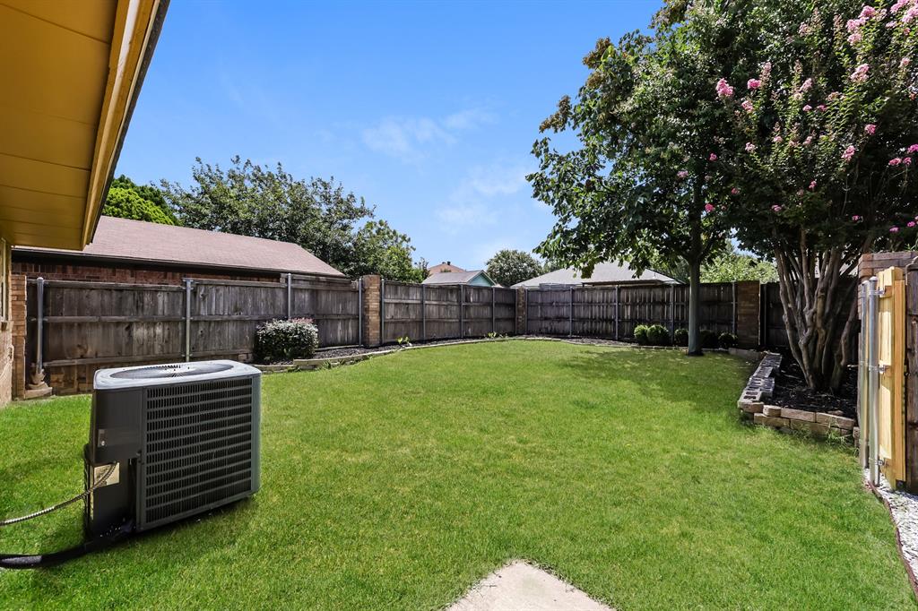 1816 Christopher Drive Fort Worth, TX 76140 - Photo 15 of 16 a view of backyard with a garden and entertaining space
