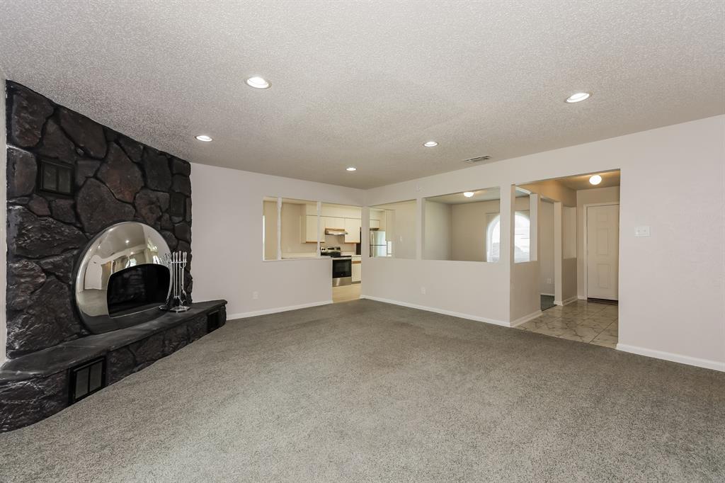 1816 Christopher Drive Fort Worth, TX 76140 - Photo 3 of 16 a view of a livingroom with furniture and a fireplace