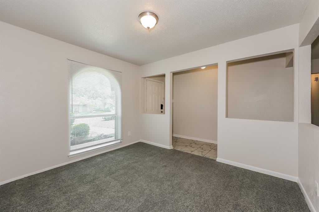 1816 Christopher Drive Fort Worth, TX 76140 - Photo 4 of 16 an empty room with windows and closet