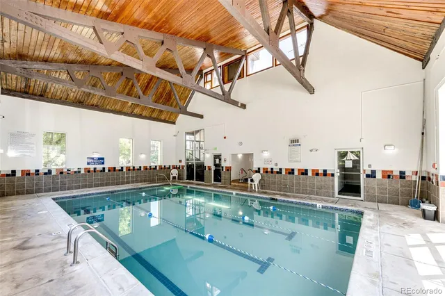a front view of a house with garden and sitting area