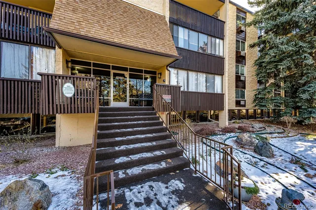 a view of a building with wooden stairs