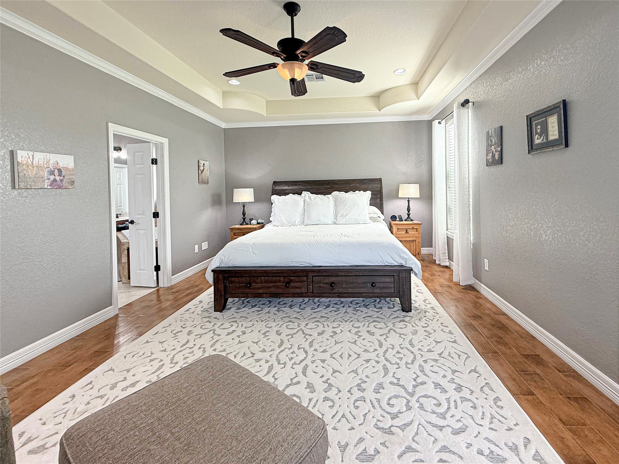 807 Mill Road Angleton, TX 77515 - Photo 23 of 46 Crown molding, abundant space, and serene backyard views create a luxurious escape.