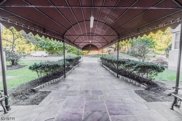 a view of pathway with a big yard