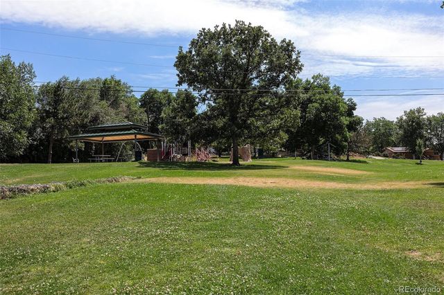 a view of a house with a big yard