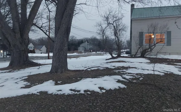 a view of a backyard of the house