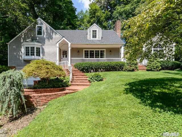 71 Davis Road Port Washington, NY 11050 - Photo 1 of 1 a front view of a house with a garden
