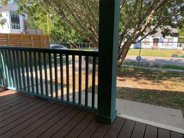a view of balcony with wooden floor