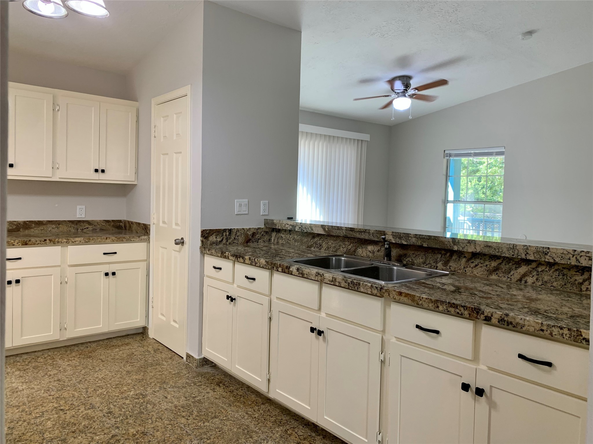 6723 Del Rio Street Houston, TX 77021 - Photo 6 of 29 a kitchen with granite countertop a sink stainless steel appliances and cabinets