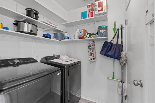 a utility room with dryer and washer