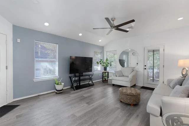 a living room with furniture and a flat screen tv
