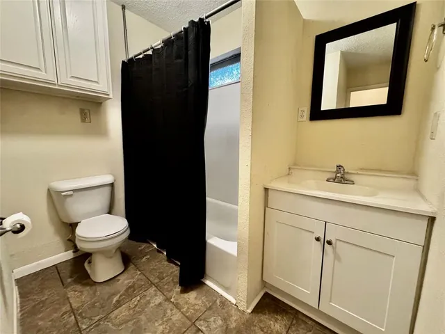 a bathroom with a sink toilet and vanity