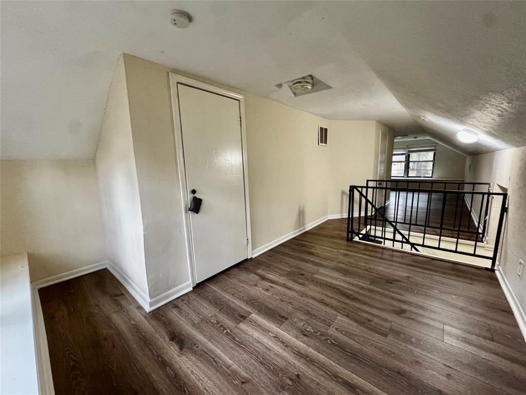 1706 Saddle Road Granbury, TX 76049 - Photo 18 of 29 a view of empty room with wooden floor