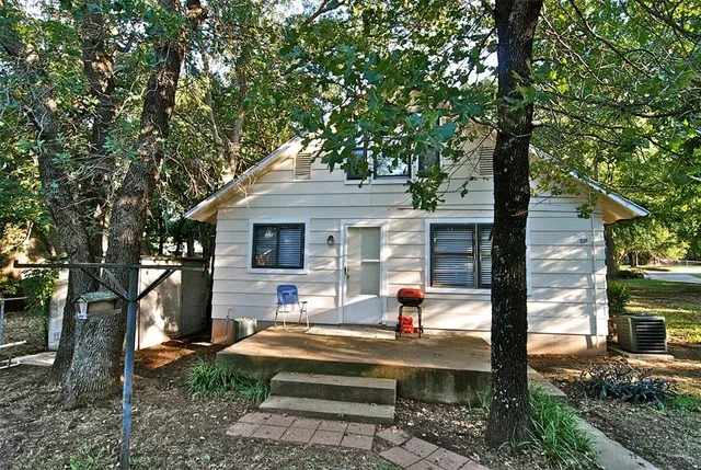 a view of house with swimming pool outdoor seating
