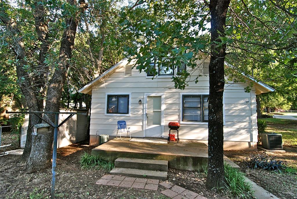1706 Saddle Road Granbury, TX 76049 - Photo 23 of 29 a view of house with swimming pool outdoor seating