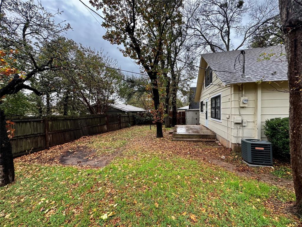 1706 Saddle Road Granbury, TX 76049 - Photo 24 of 29 a view of a backyard with a tree