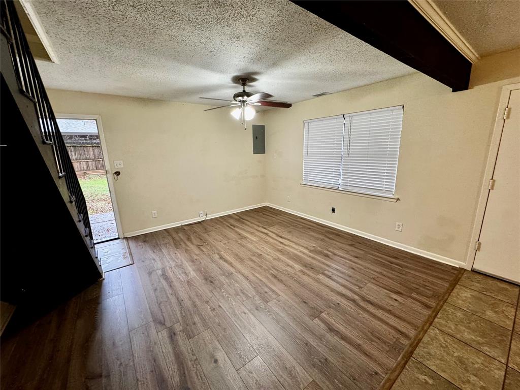 1706 Saddle Road Granbury, TX 76049 - Photo 5 of 29 wooden floor in an empty room with a window