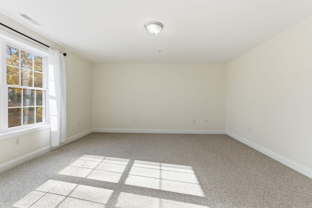 90 Rangeway Road, Unit 303 Billerica, MA 01862 - Photo 17 of 34 an empty room with a window